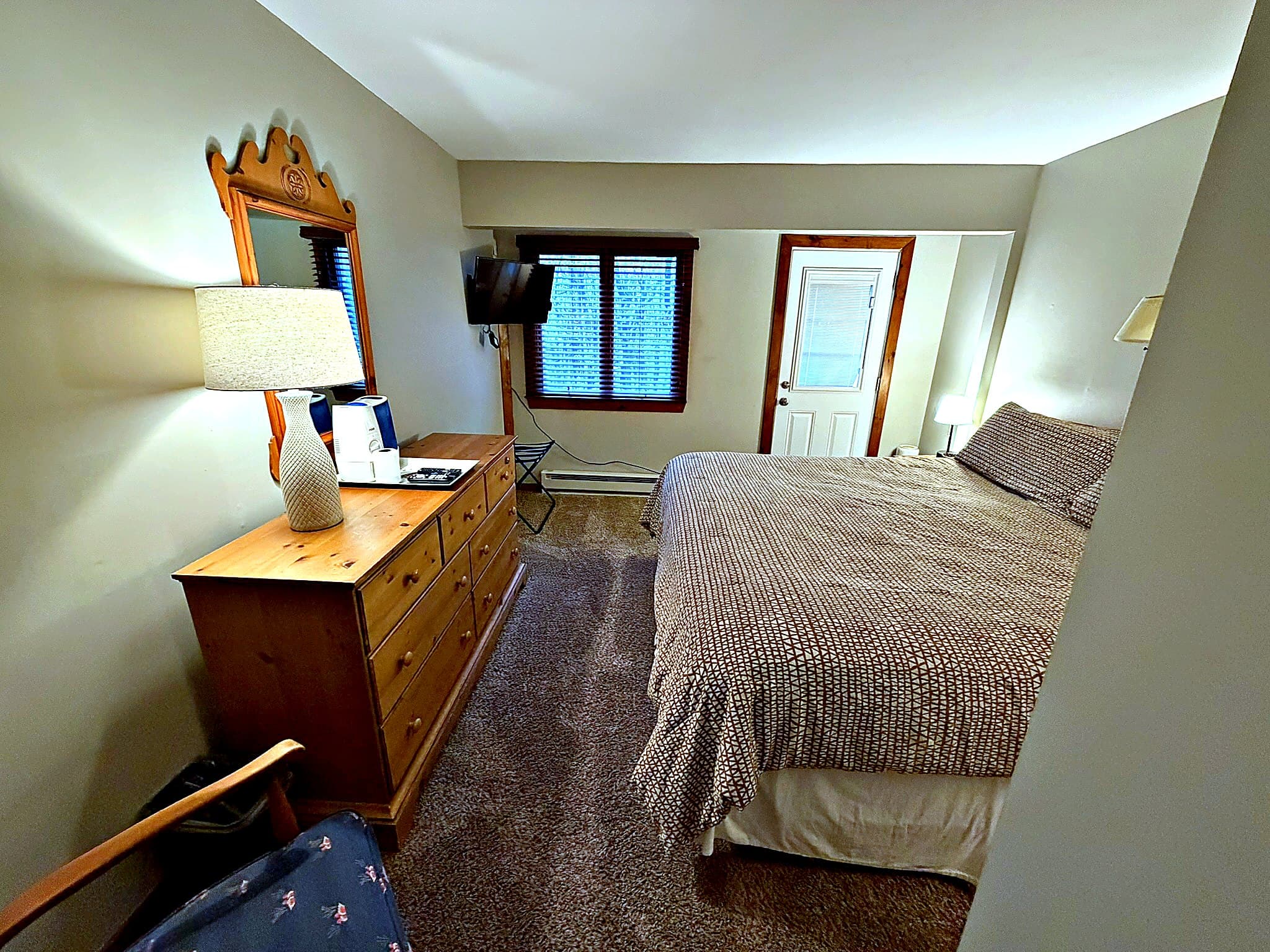 Second bedroom with king bed and dresser