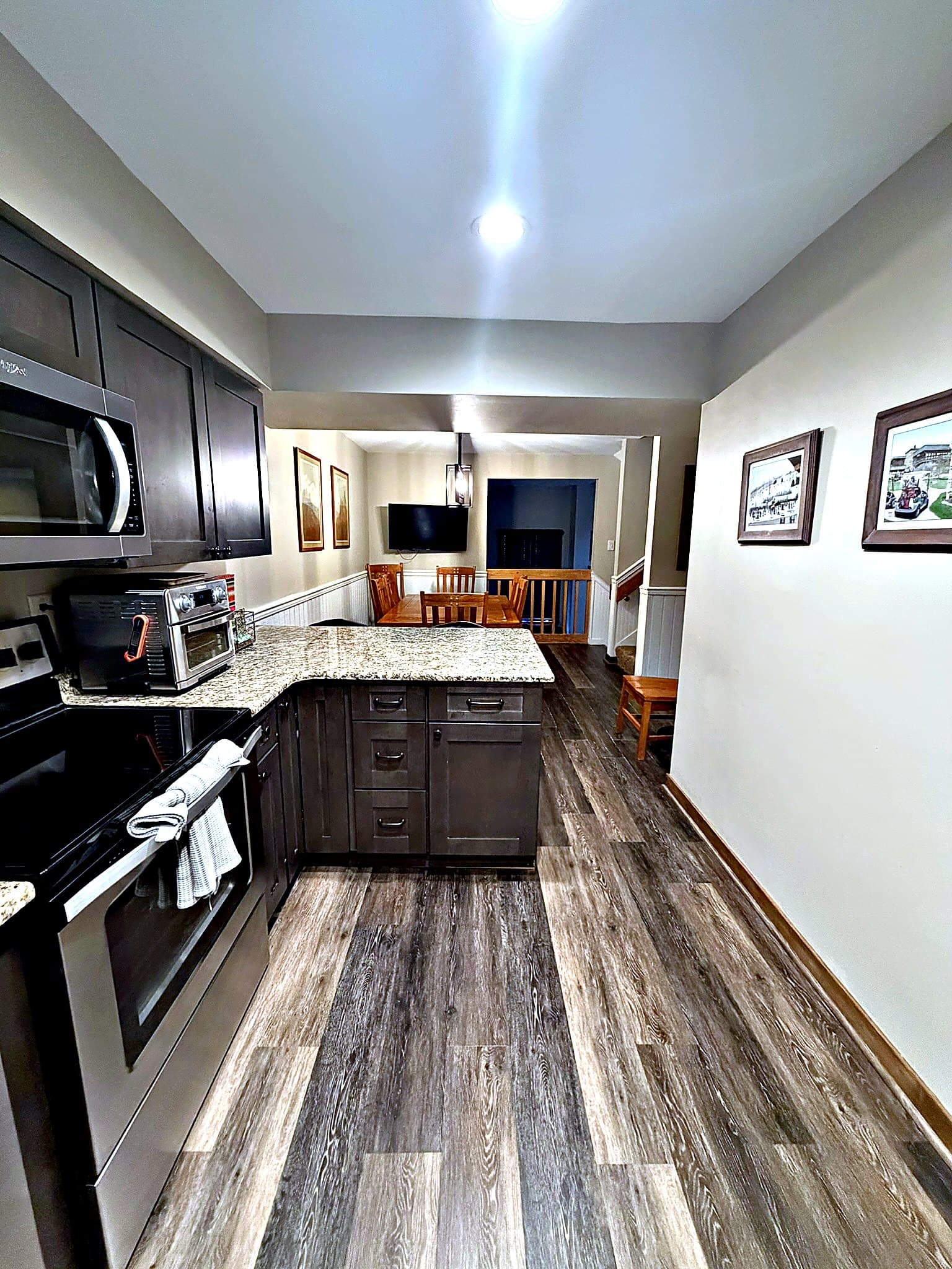 Stone fireplace and main living from loft view