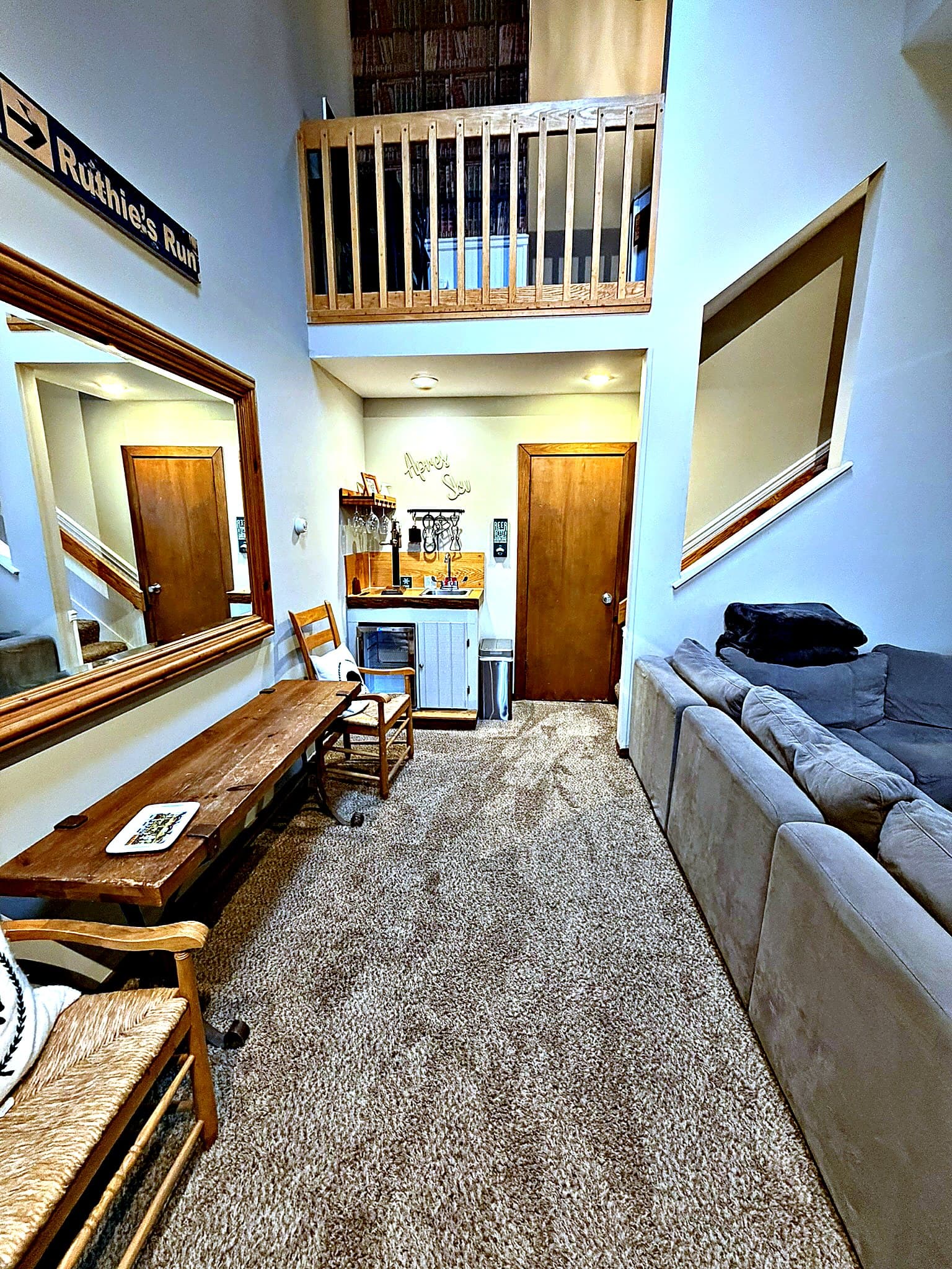 Two-story vaulted living area with wet bar