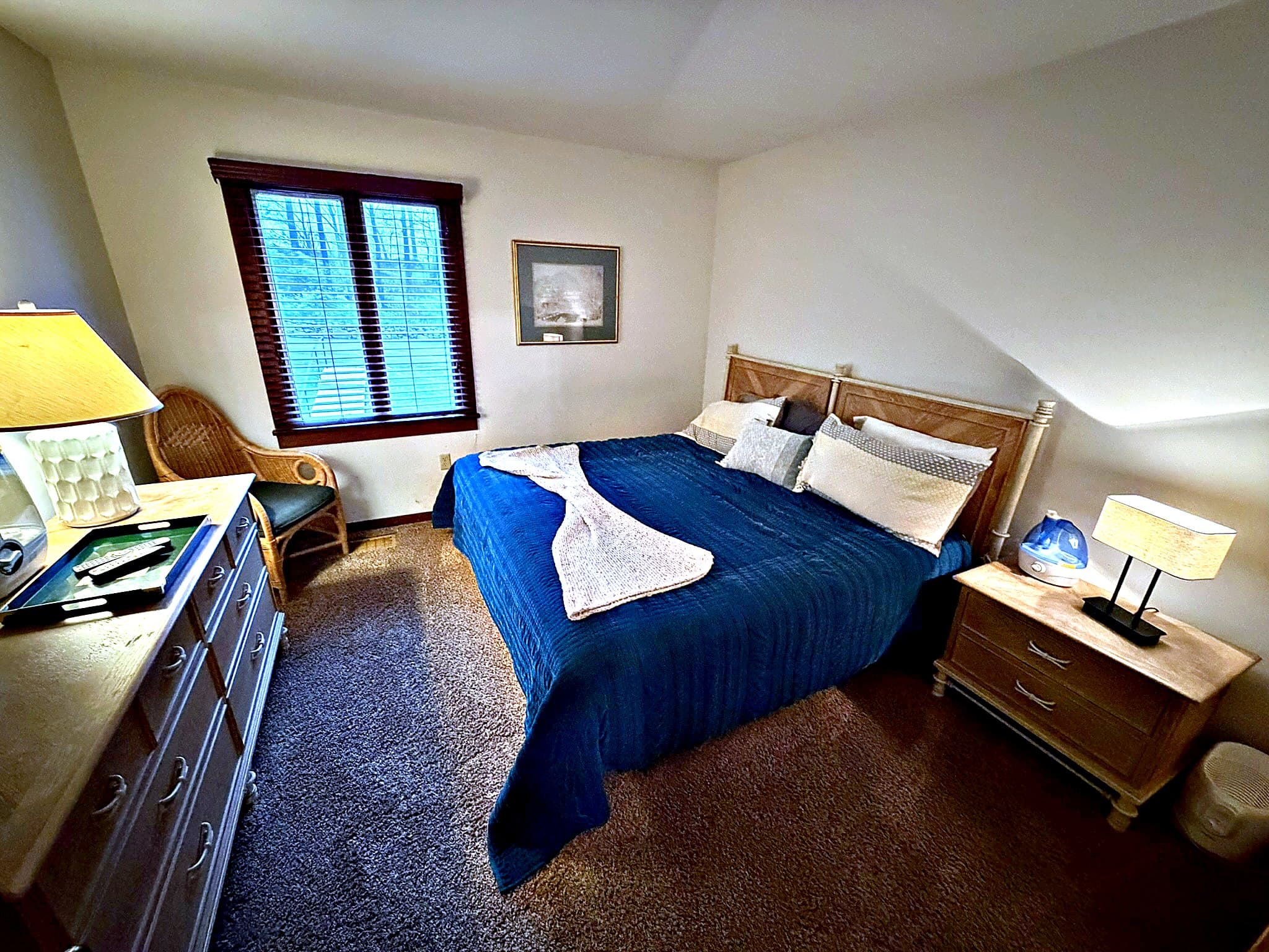 Second bedroom — king bed with blue comforter