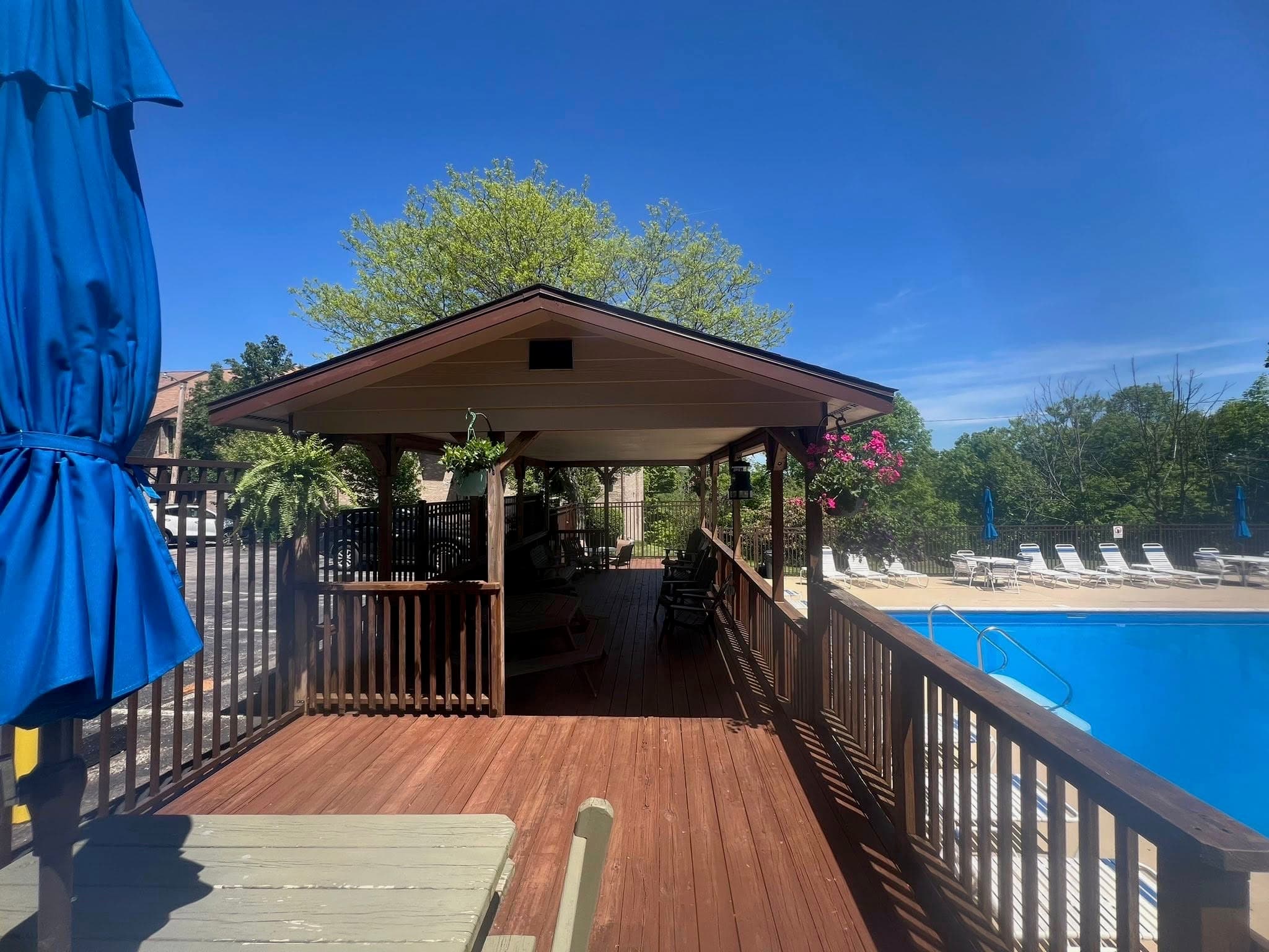 Covered poolside pavilion and deck for shaded gatherings